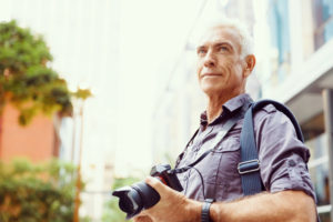 older man with camera