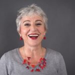 Happy older woman smiling at the camera