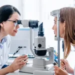 ophthalmologist checking eye