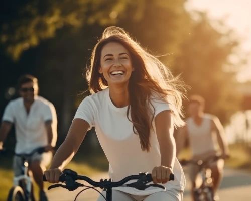 woman riding a bike without glasses after successful lasik procedure